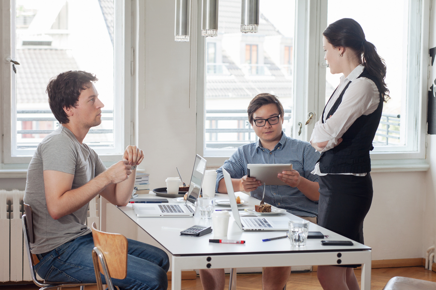 Female Boss Talking to Employees